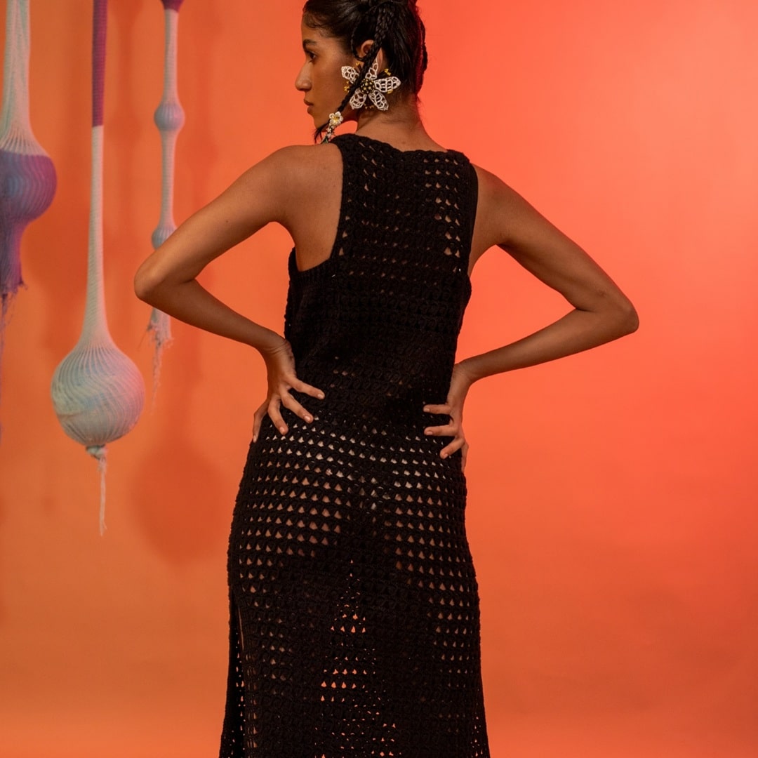 Back view of the Halo Dress, showcasing its sleeveless design and elegant fit.