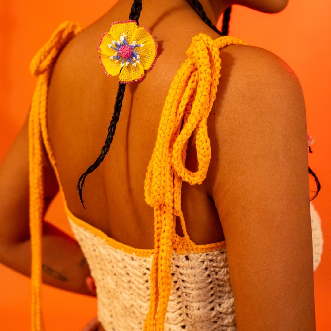 Side angle of the Horizon crochet top, highlighting the delicate shoulder ties for a relaxed fit.