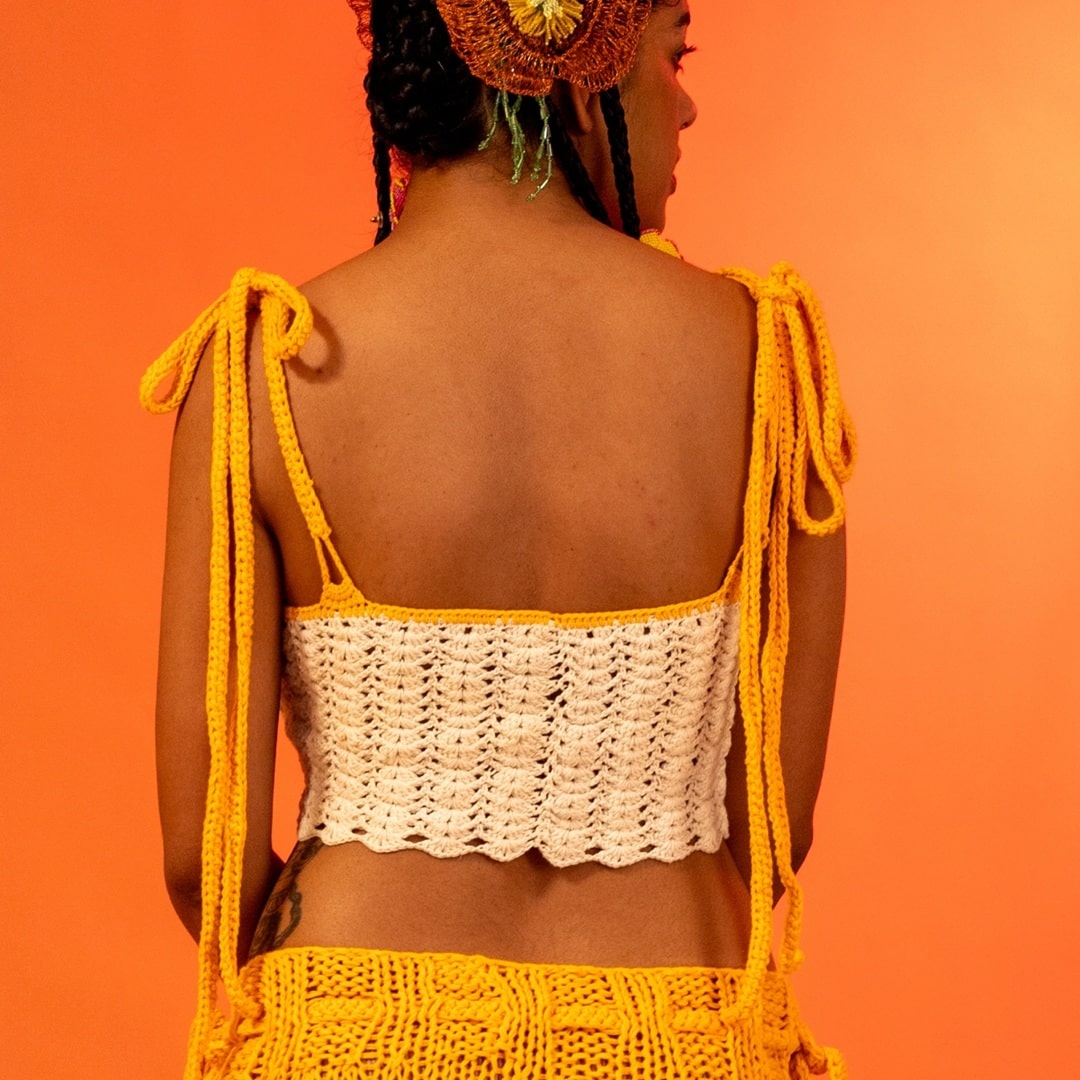 Back view of the Horizon crochet top, showing the beautiful open design with long ties for adjustability.