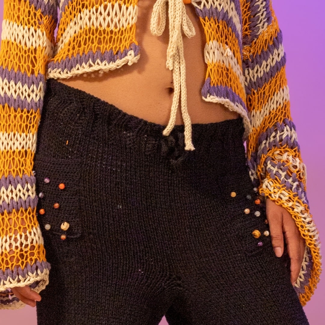 Close-up of celestial beadwork on the pockets of Midnight pants.
