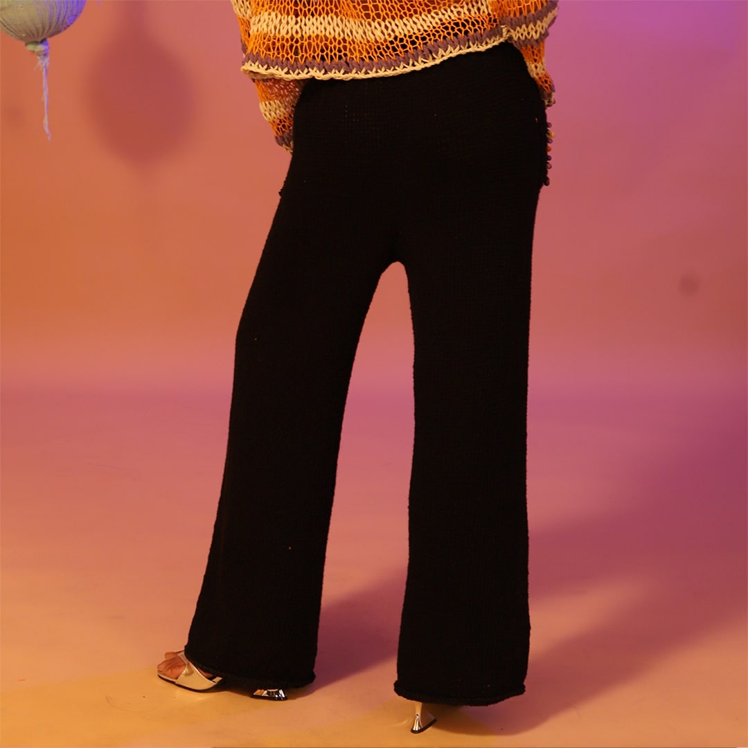 Back view of the Midnight hand-knitted pants showcasing a soft cotton weave.