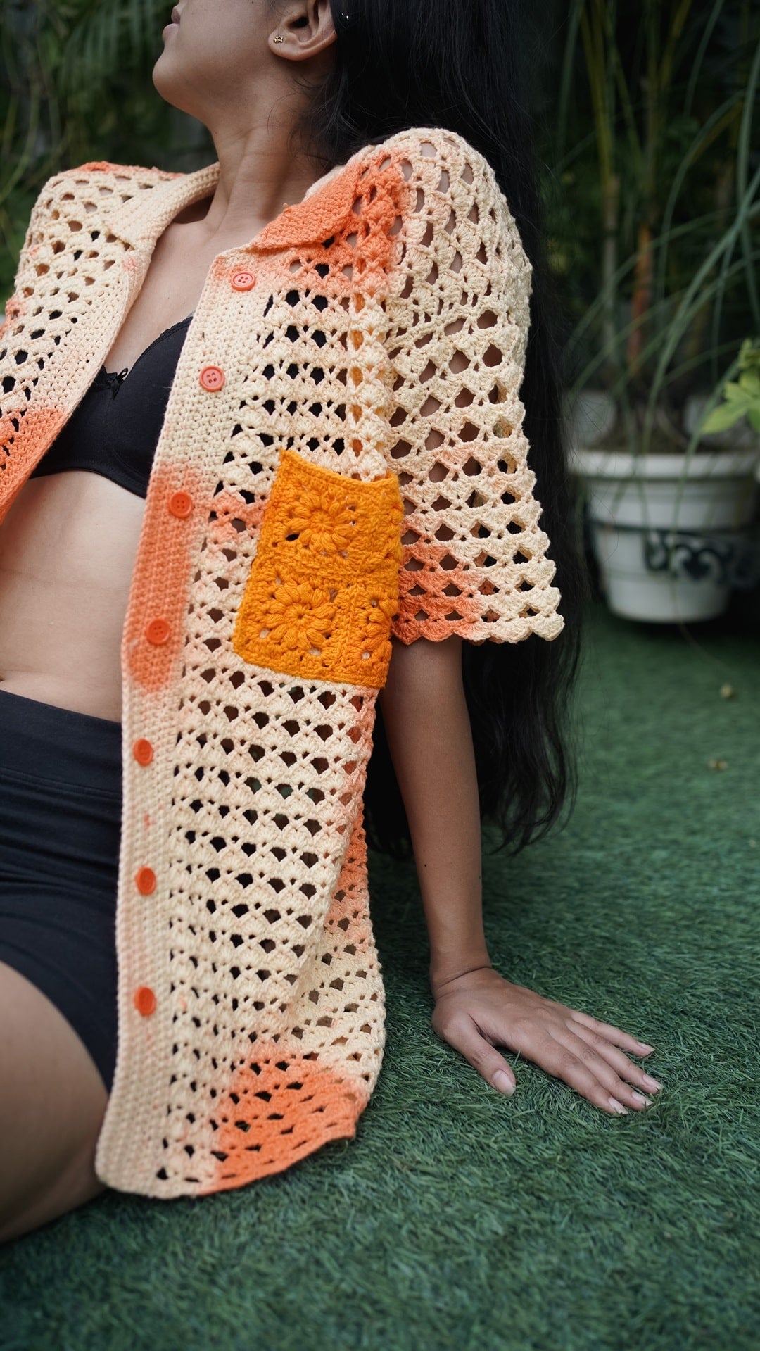 Close-up of the sunflower pocket detail on the Sundaze Crochet Shirt.