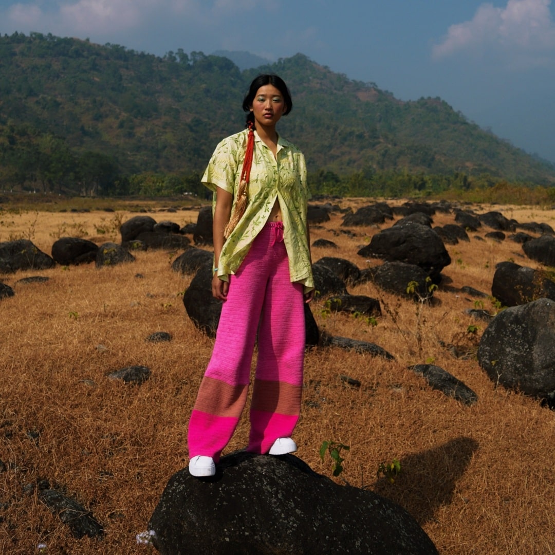 Pink Fluorite crochet pants featuring a high-rise ribbed waistband and straight fit.