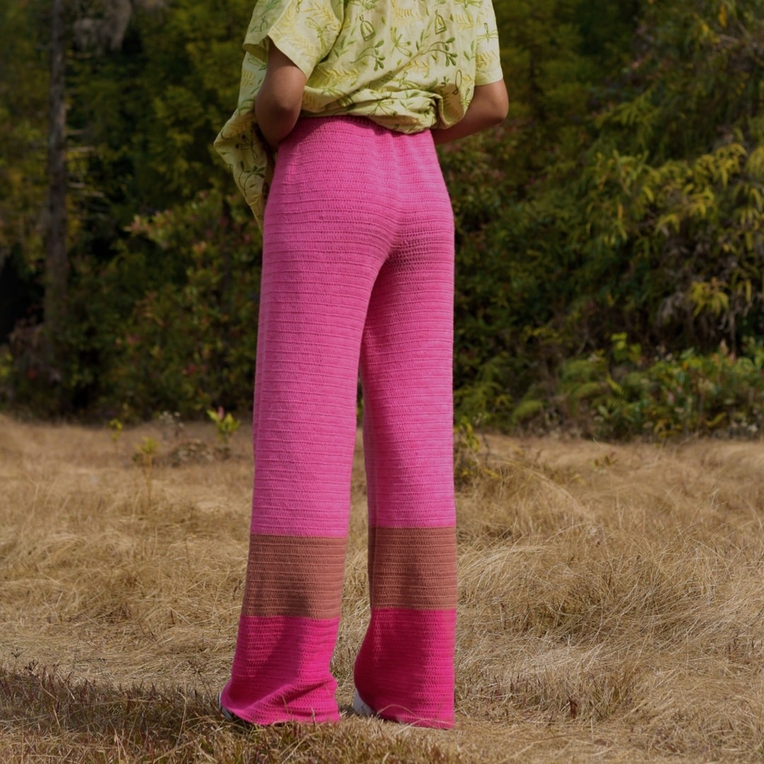 Back view of Pink Fluorite crochet pants highlighting the seamless crochet pattern.