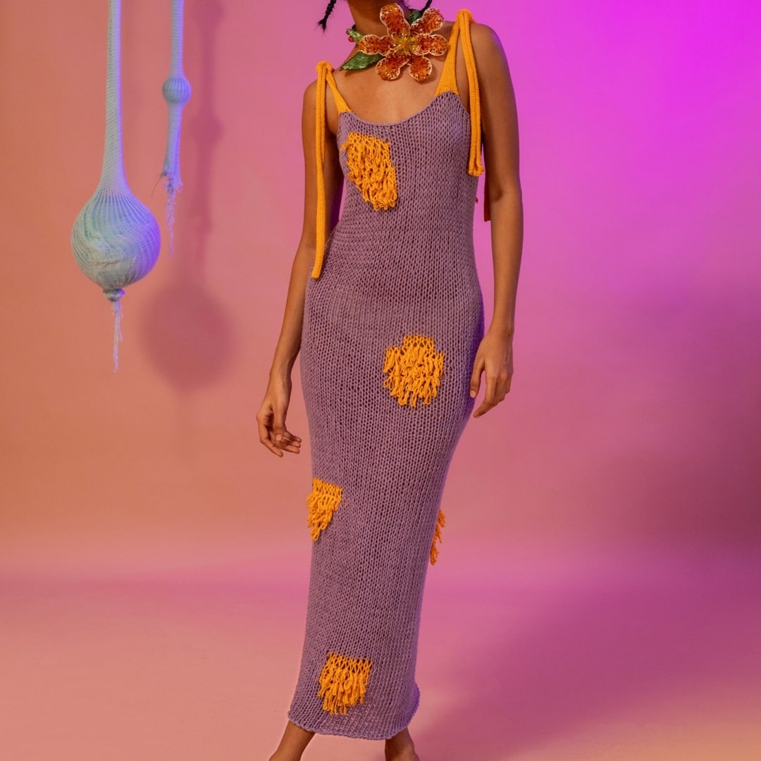 Front view of the Fading Fire Dress, a hand-knitted dress in bold sunset hues.