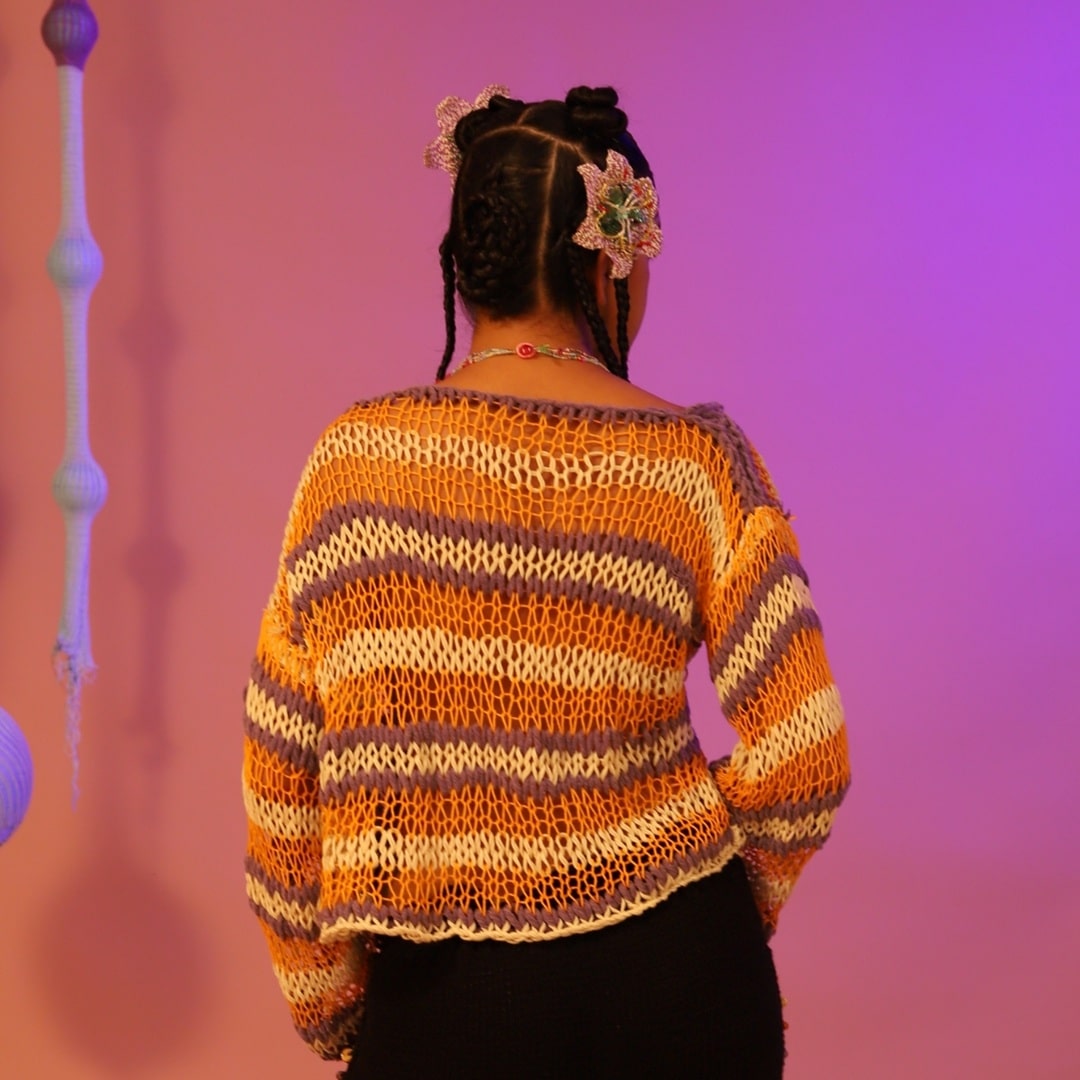 Back view of the lightweight Molten Sky hand-knitted shirt in cotton knit.