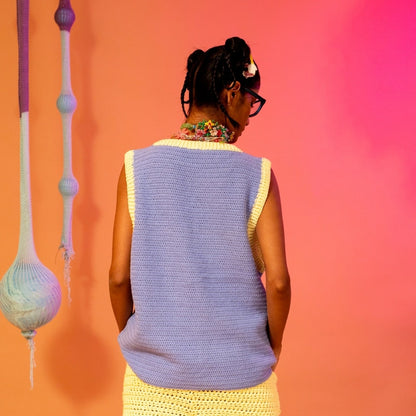 Back view of the Sun Shower Vest showing its relaxed fit and clean crochet detailing.