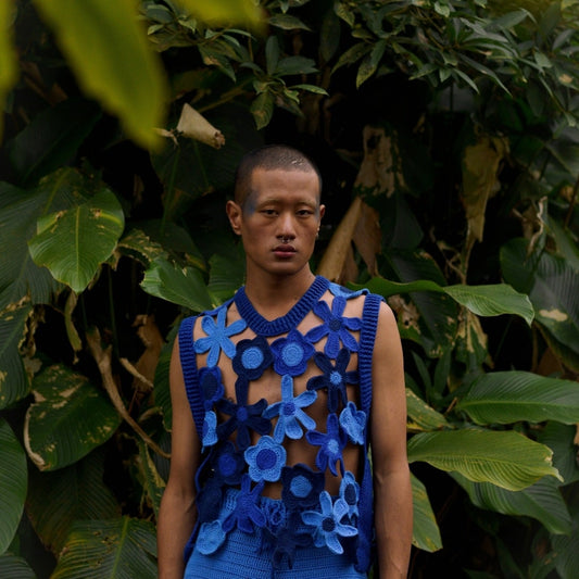 Handmade floral crochet vest in shades of blue, adding a stylish and breathable layer to any outfit.