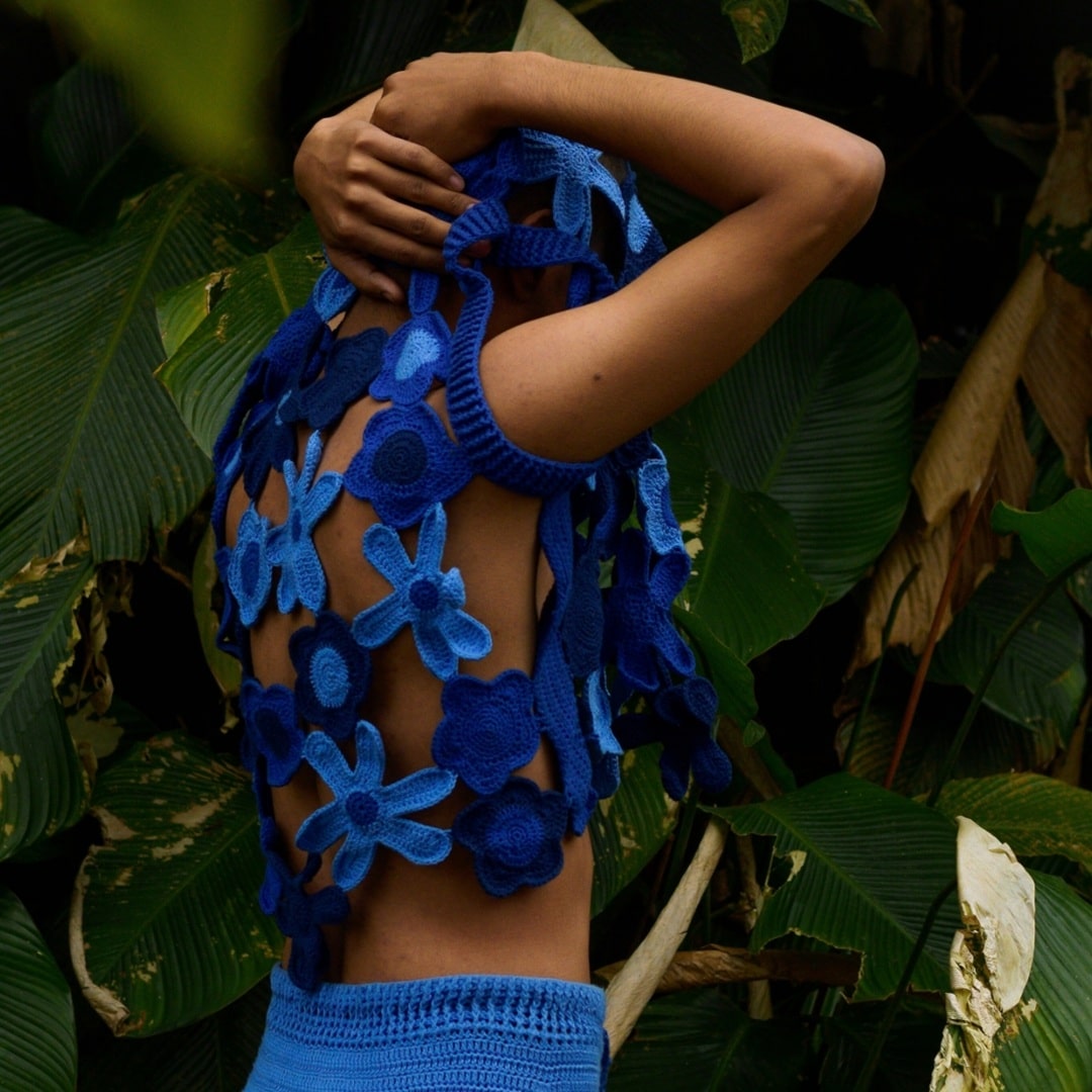Open-weave floral crochet vest designed for effortless layering and a breezy summer vibe.