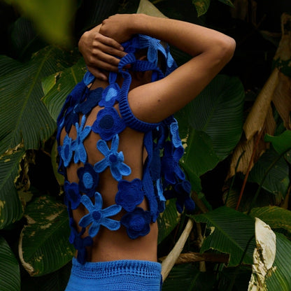 Open-weave floral crochet vest designed for effortless layering and a breezy summer vibe.