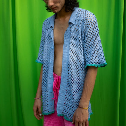 Close-up of the elbow-grazing sleeves and buttoned collar of the Peekaboo Crochet Shirt.
