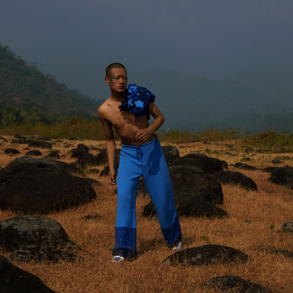 Model wearing Sapphire crochet pants in nature – breathable and comfortable.