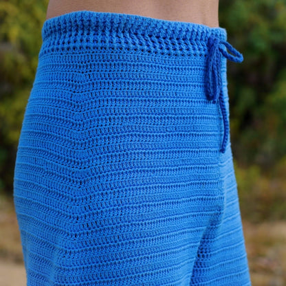 Close-up of ribbed waistband with drawstring on Sapphire crochet pants.